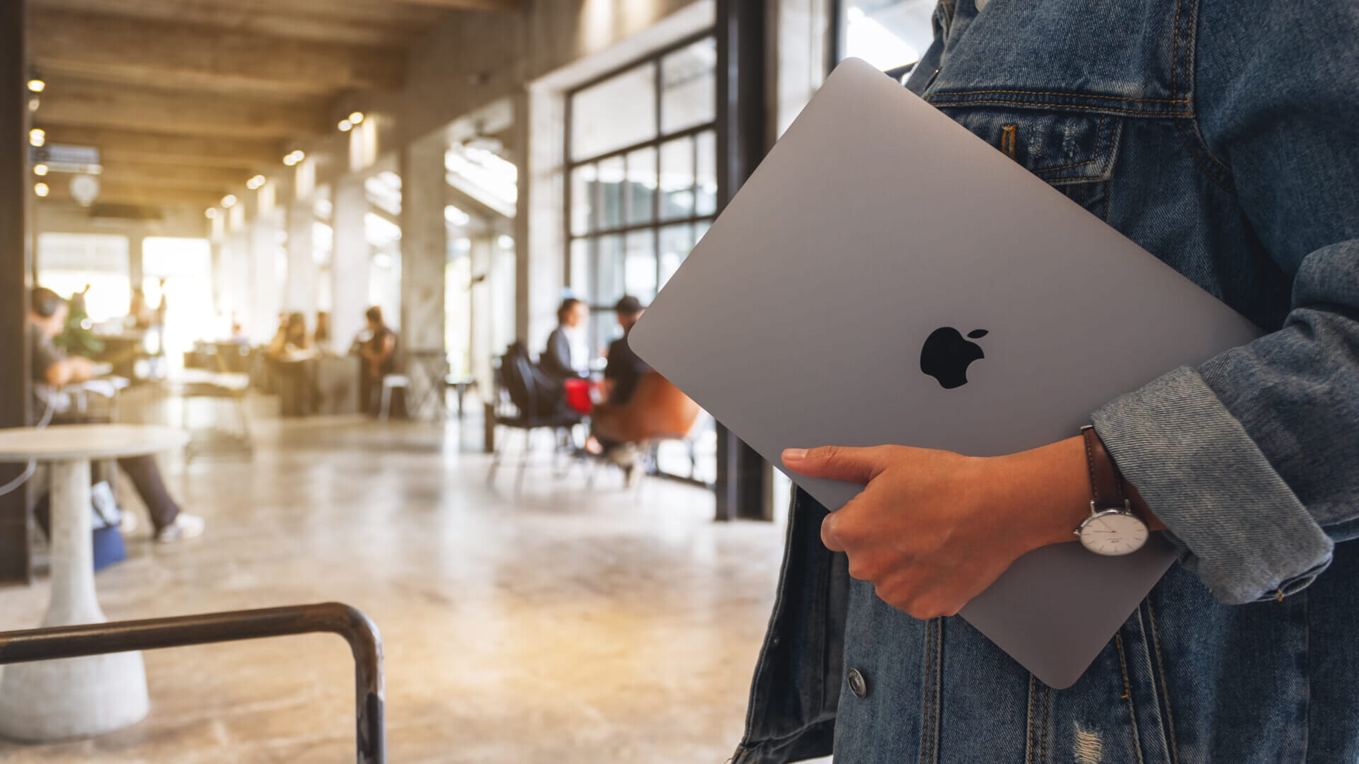 Sep 16th 2020 : A woman holding an Apple MacBook Pro laptop computer to go to somewhere , Chiang mai Thailand